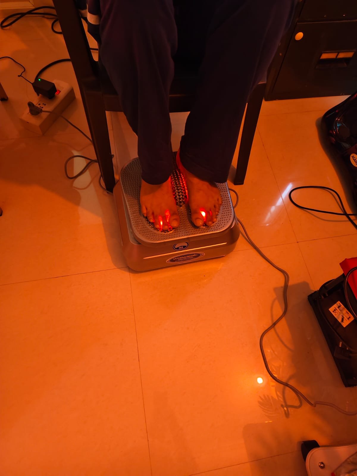 Client receiving red light therapy along the spine